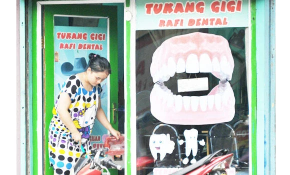 Indonesia’s illegal dentists vow to fight back after ban