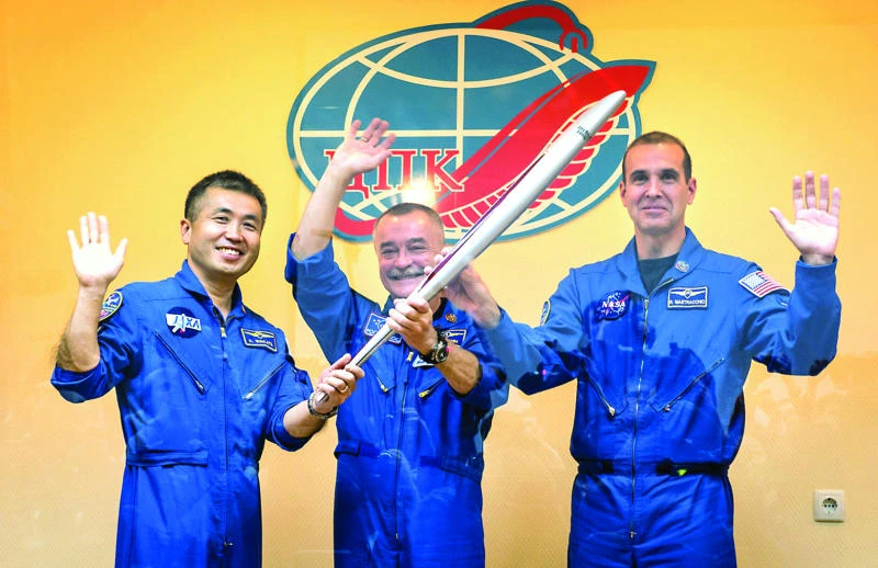 Astronauts take Sochi Olympic torch to ISS