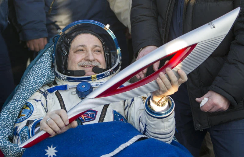 Olympic torch returns home from space station