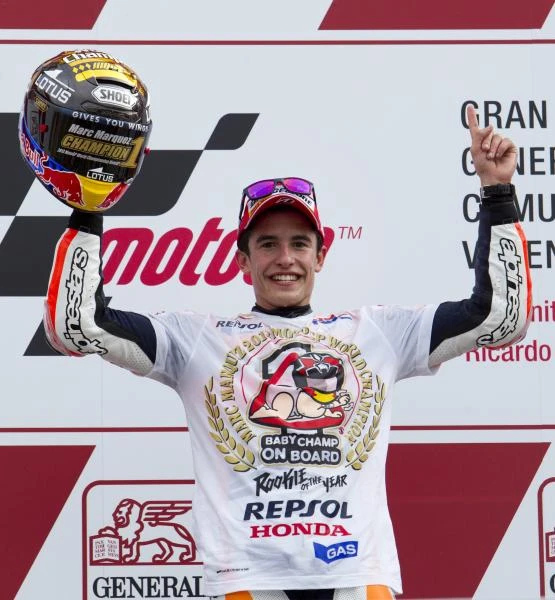 Marquez roars to historic MotoGP world title