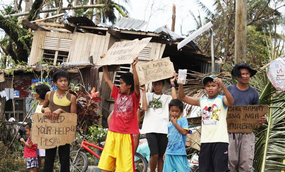 Typhoon-hit victims in Philippines plead for aid