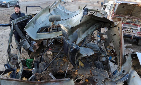 Iraq market and cemetery bombs kill 11