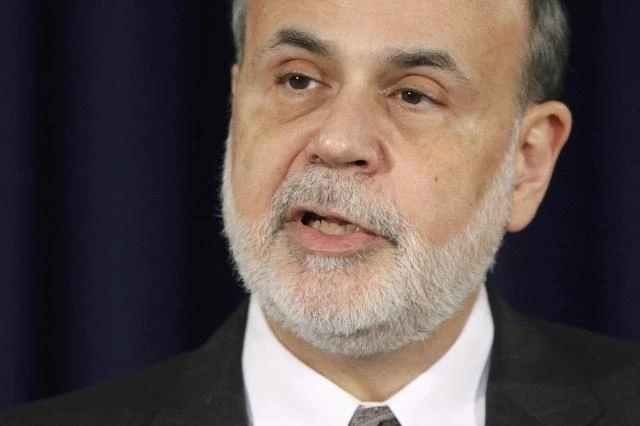 Fed cuts bond-buying but stresses easy policy