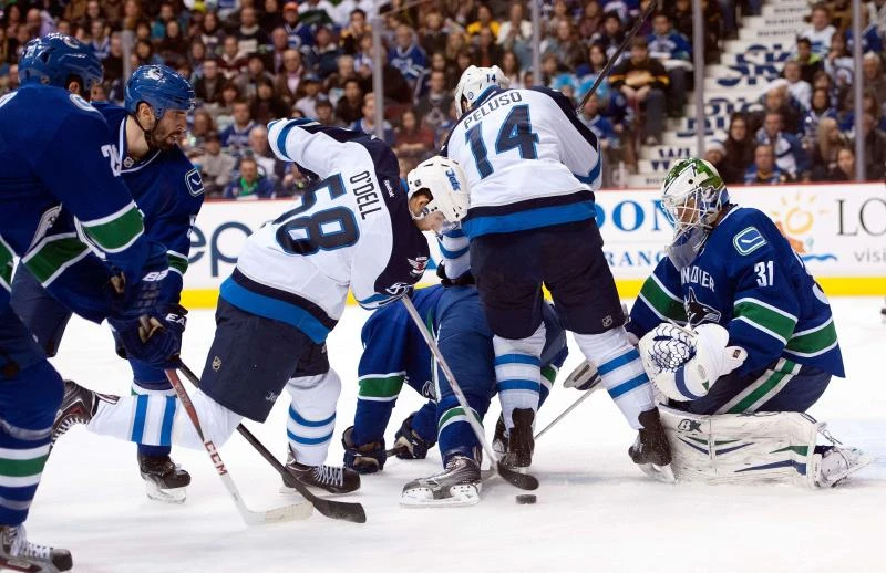 Luongo injured as Canucks ekes past Jets
