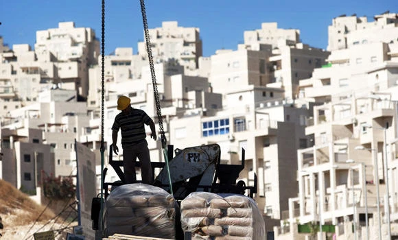 Israel to free Palestinians, build more settlements