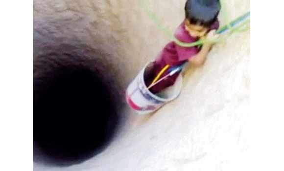 ‘Irresponsible’ father uses young son to clean well