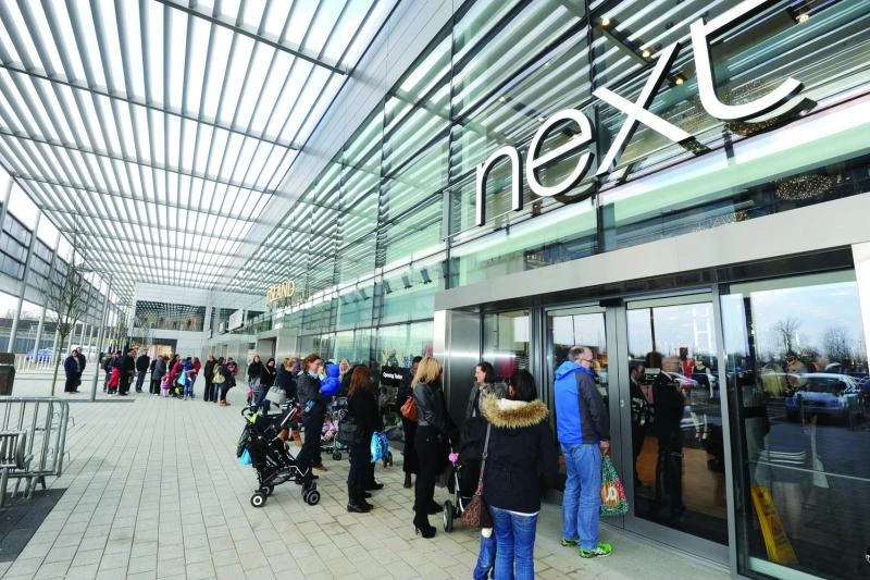 Next shares hit record after sales increase 11.9 percent