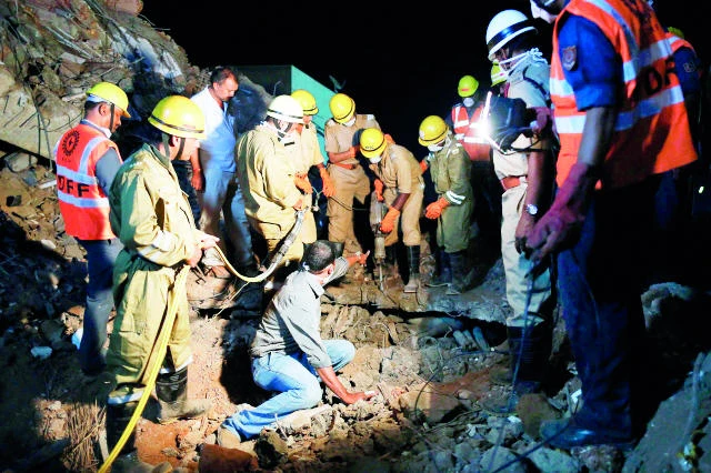 Rescuers dig for building collapse survivors in Goa