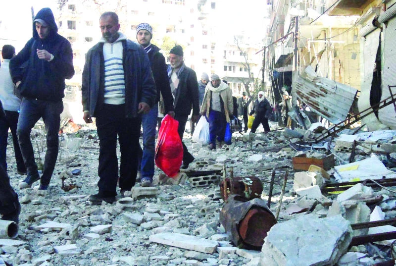 First group of trapped Syrians evacuated from besieged Homs