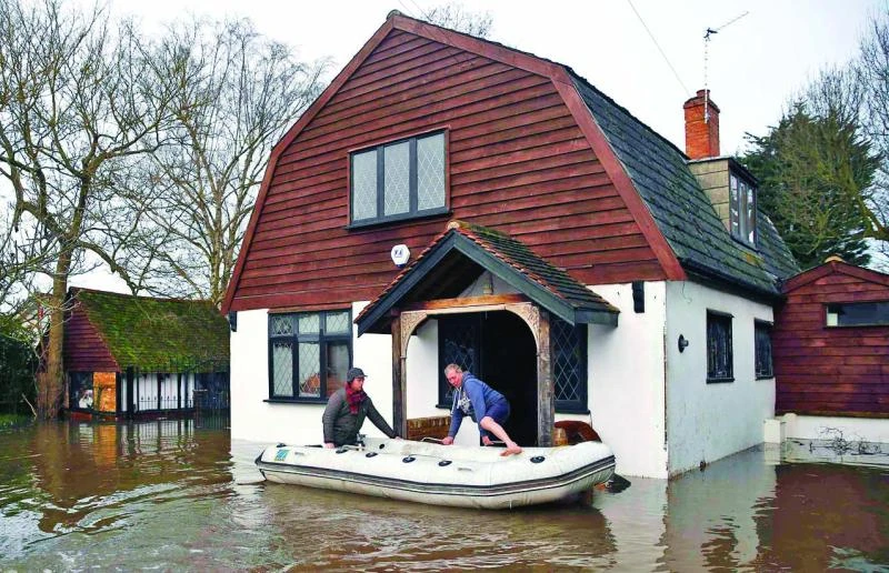 Flood warning for Thames as blame game rages