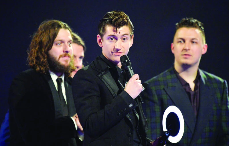 Bowie becomes oldest Brit winner, but Arctic Monkeys steal show