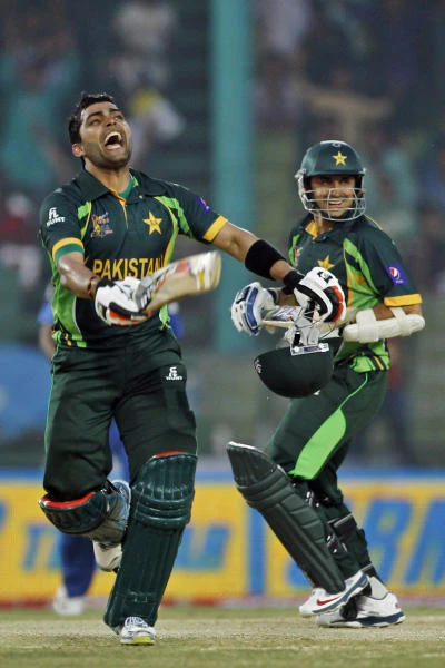 Akmal ton helps Pakistan ease past Afghanistan