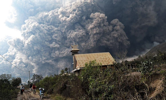 Indonesian volcano erupts again; kills at least 14
