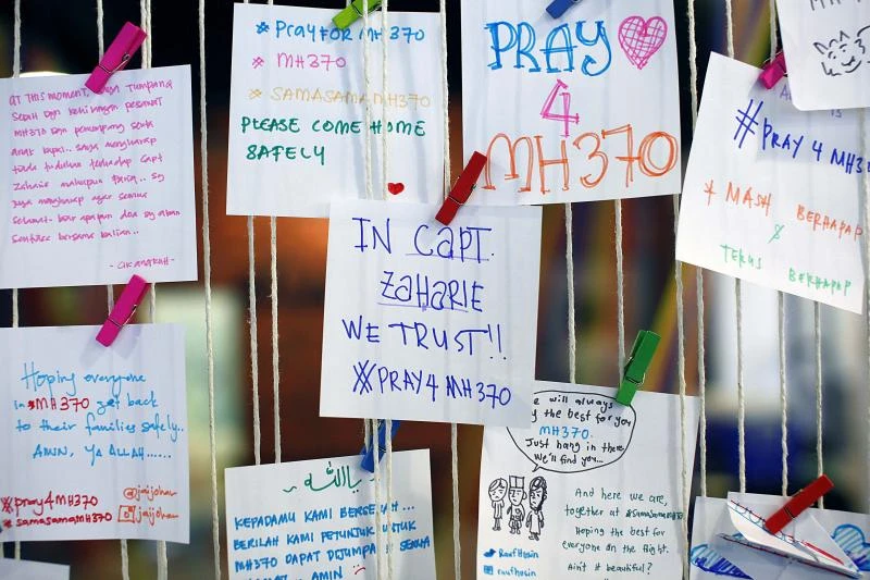 Son defends pilot of downed Malaysian jet