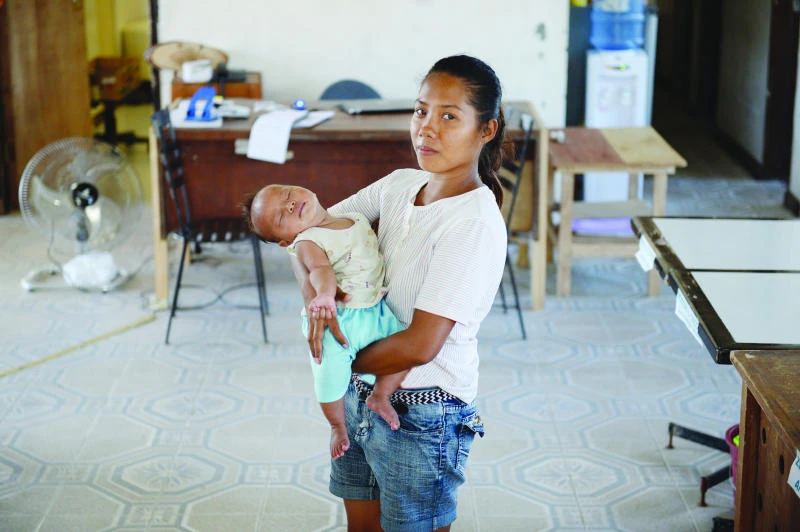 Philippine typhoon mother rises up from the ruins