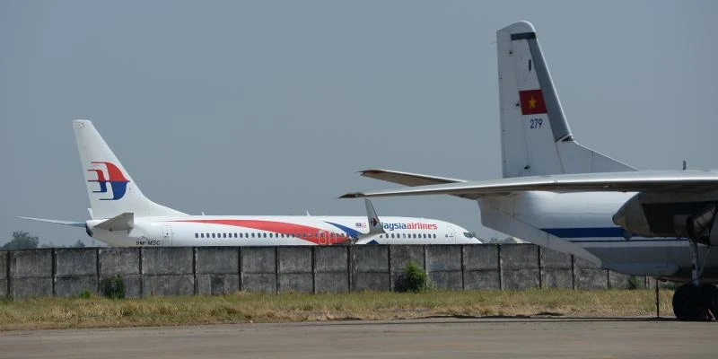 Focus back on Malaysia plane pilots, stolen passports