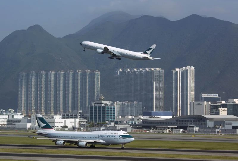 Cathay Pacific says net profit tripled in 2013