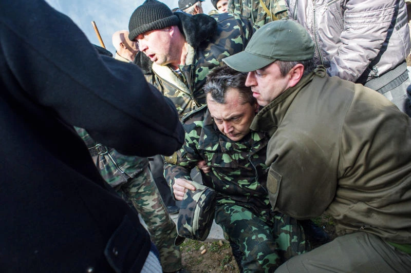 Russian forces storm Ukraine naval headquarters in Crimea