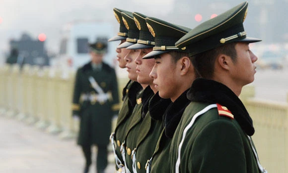 Thousands in China protest after officials beat vendor, passer-by