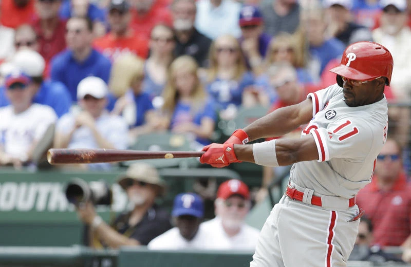 Rollins, Phillies down Rangers 14-10