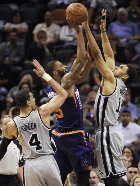 Spurs secure top spot in West, beat Suns