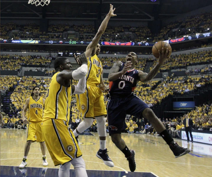 Hawks upset Pacers as road teams thrive on opening day