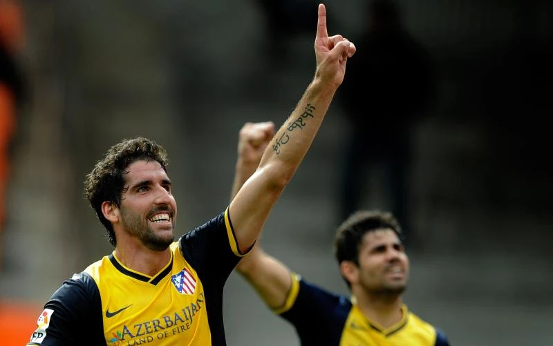 Atletico wins at Valencia to move closer to title