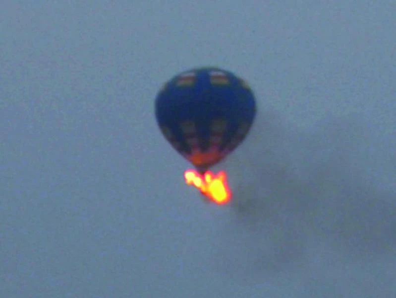 1 dead, 2 missing after balloon catches fire