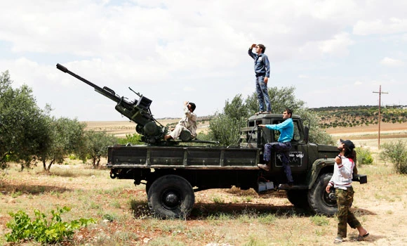 Activists say chlorine attack kills teenager in central Syria