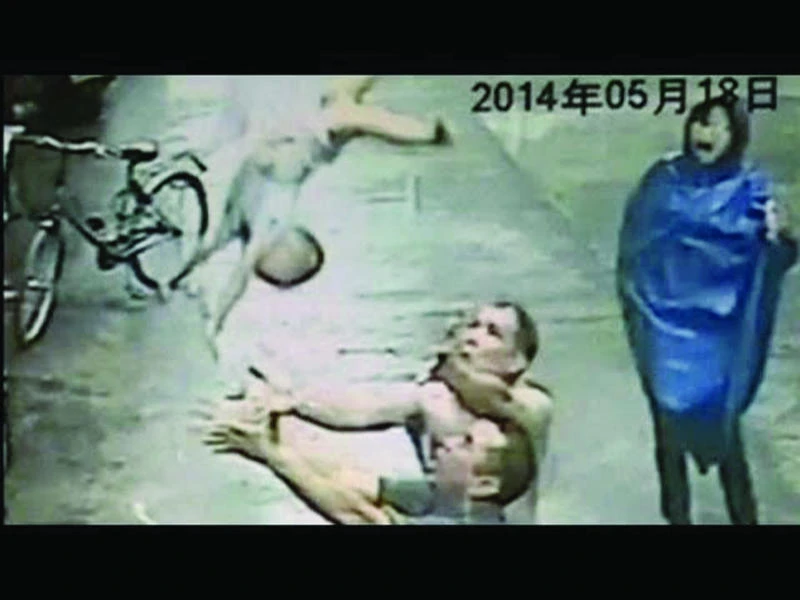 Chinese men catch baby falling from building