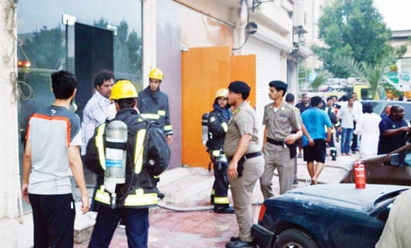 Girl jumps out of blazing building