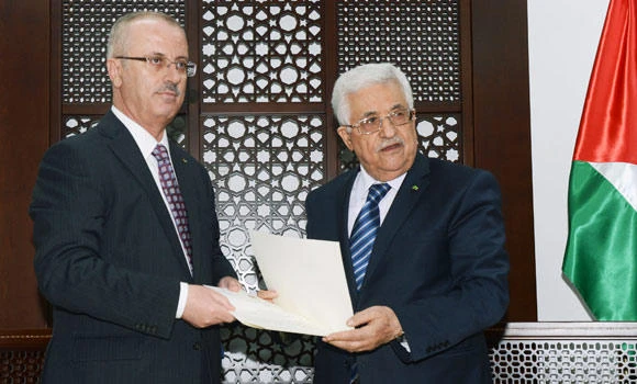 Abbas asks West Bank PM to form unity govt