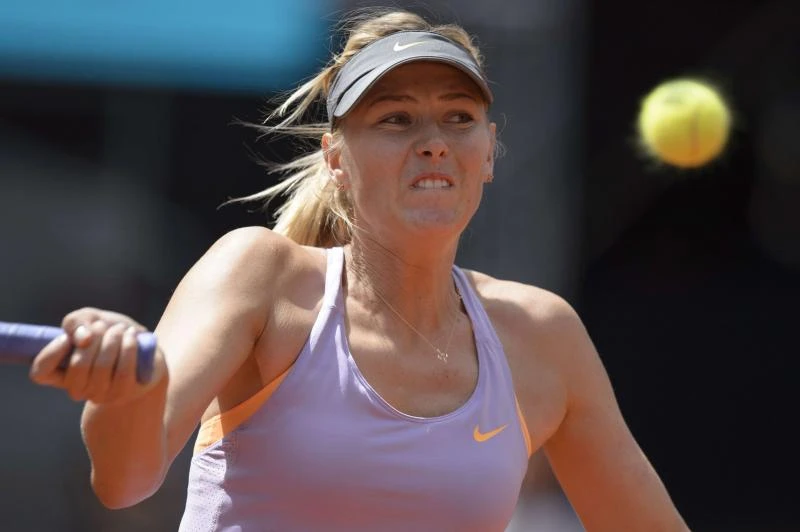 Federer withdraws, Li and Sharapova advance in Madrid