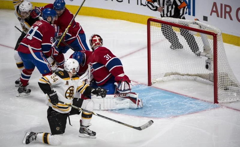 Bruins edge Canadiens in OT to square series