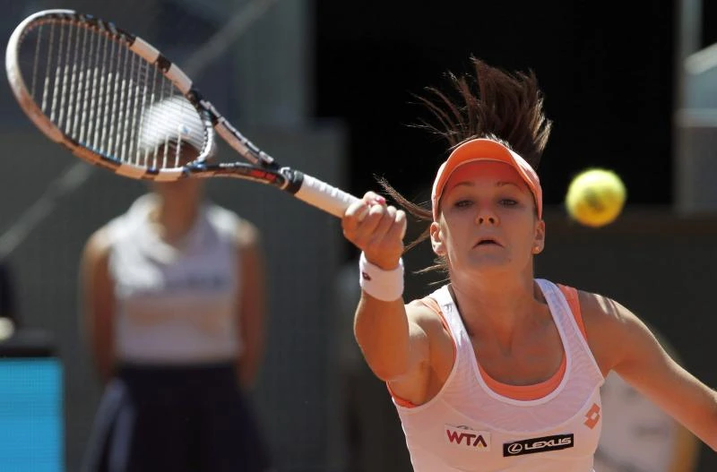 Li Na, Radwanska safely through in Madrid