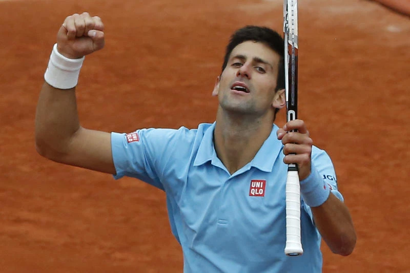 Gulbis shocks Federer, Djokovic cruises into last eight
