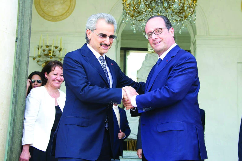 Hollande and Alwaleed meet at Elysee Palace