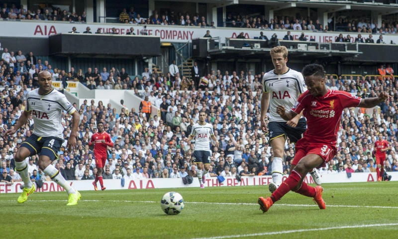 Liverpool thumps Spurs, Arsenal held by Leicester