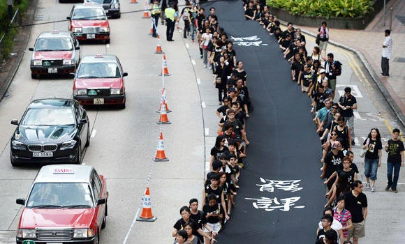 Pro-democracy activists stage ‘black cloth’ march in Hong Kong