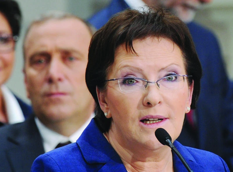 New Polish PM brings her rival into govt