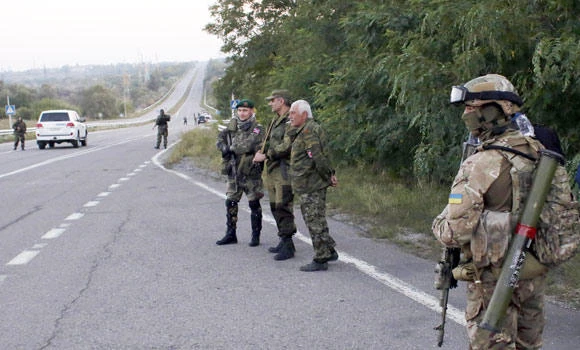 Ukraine troops prepare pullback as truce holds