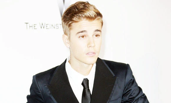 Paparazzi charged over chasing Bieber