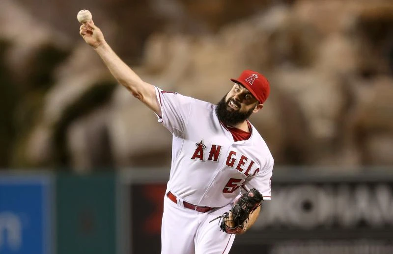 Angels sink Mariners 8-1 to clinch playoff spot