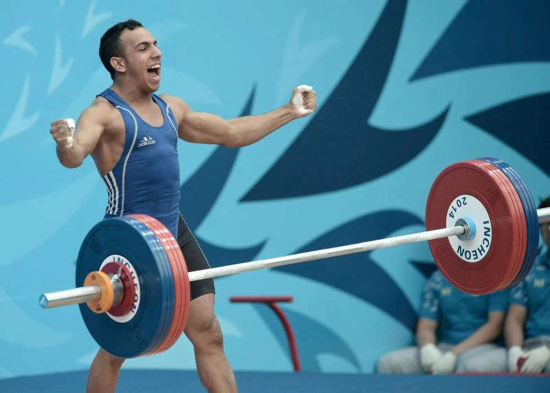 North Korean lifter breaks record as competition begins
