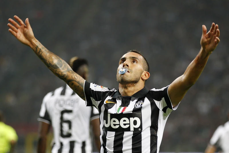 Tevez on target again as Juve stuns Milan