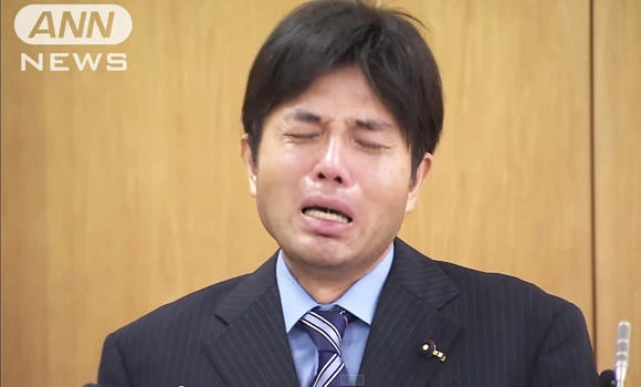 Japan's crying lawmaker sparks pay cuts