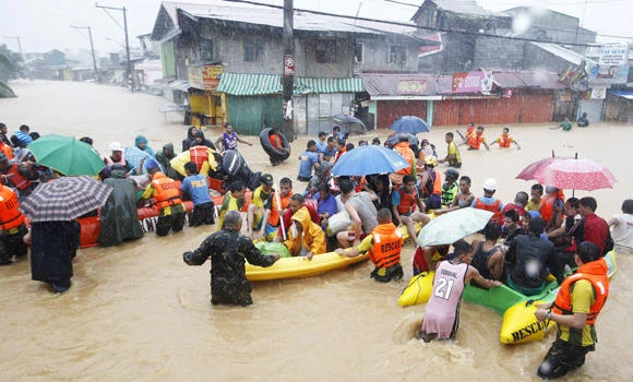 Tropical storm flooding shuts down Philippine capital