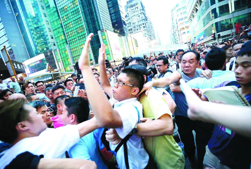 Pro-Beijing groups clash with protesters