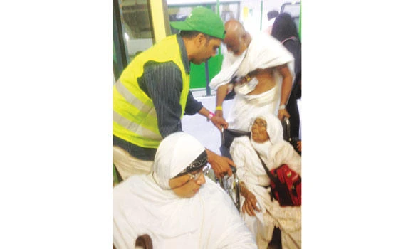 Seeking the pleasure of Allah, volunteers help the weak and elderly perform Haj