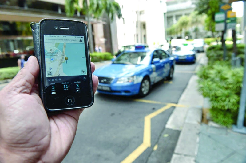 Uber in spotlight as mobile apps rattle Asia’s taxis